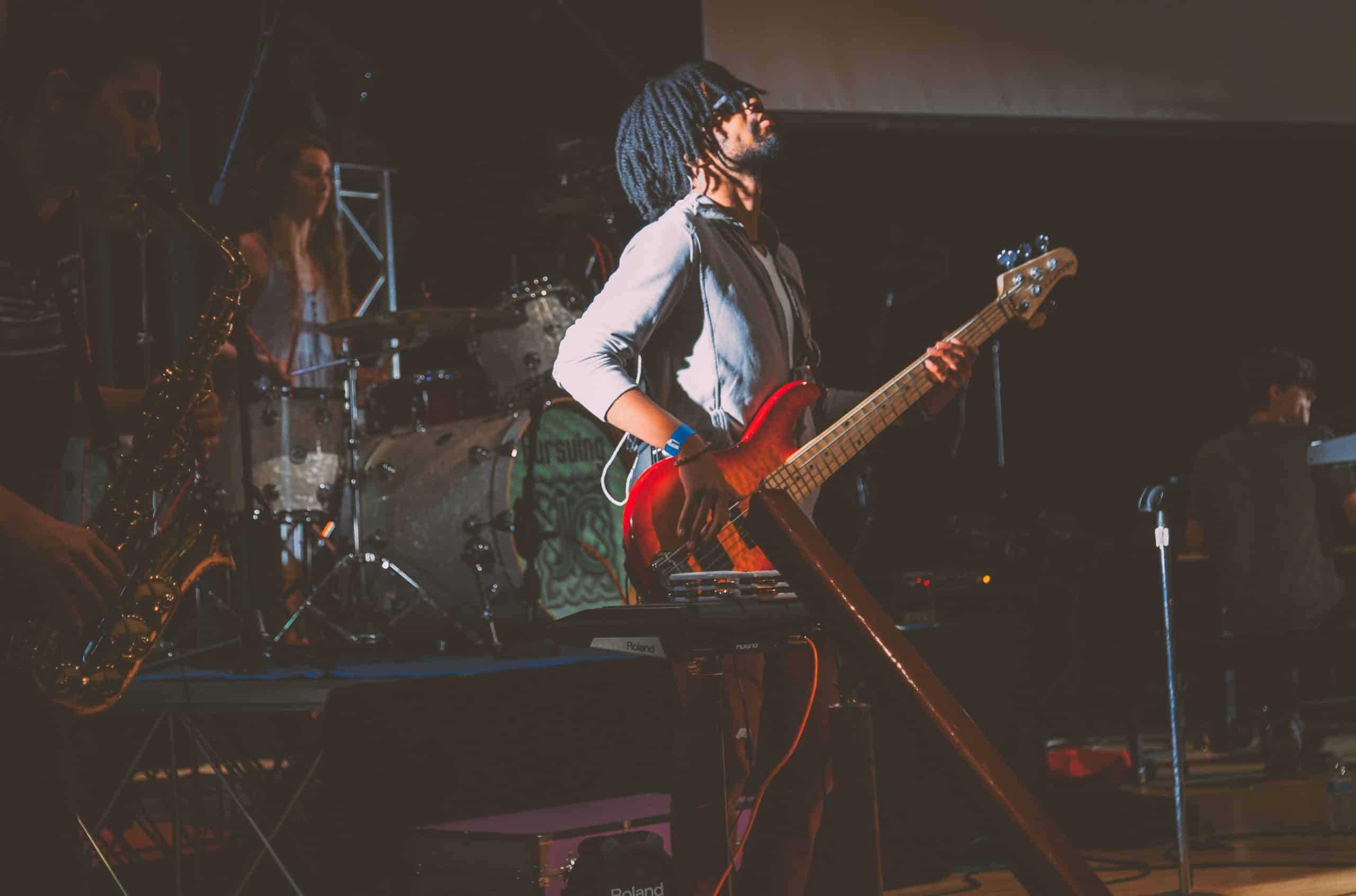 man-standing-while-playing-guitar-1588075-scaled-1